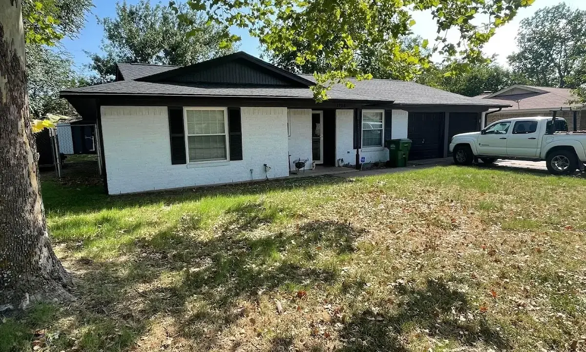 Professional roofing crew working on a residential roof in Grand Prairie